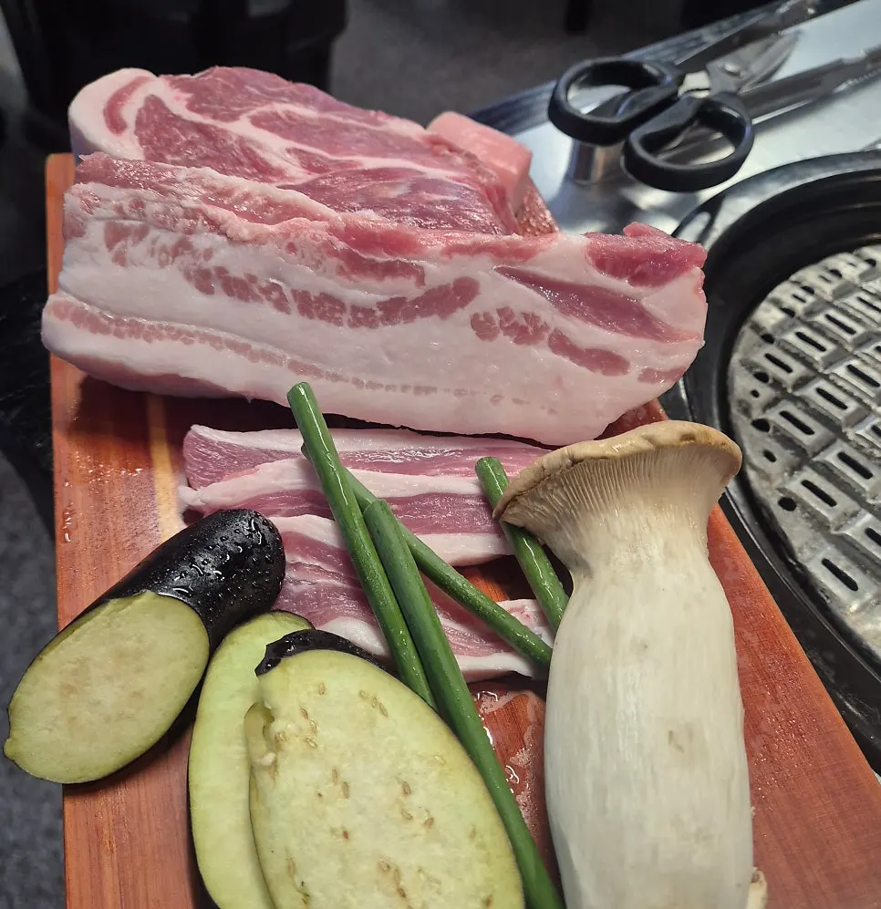 Yukjjip mixed platter with pork neck, whole belly, and gabrisal