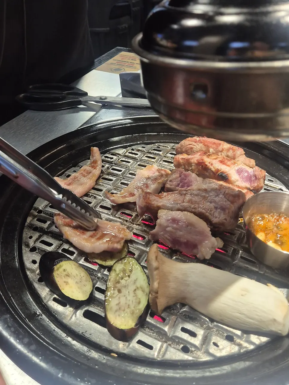 Thick whole pork belly on the grill