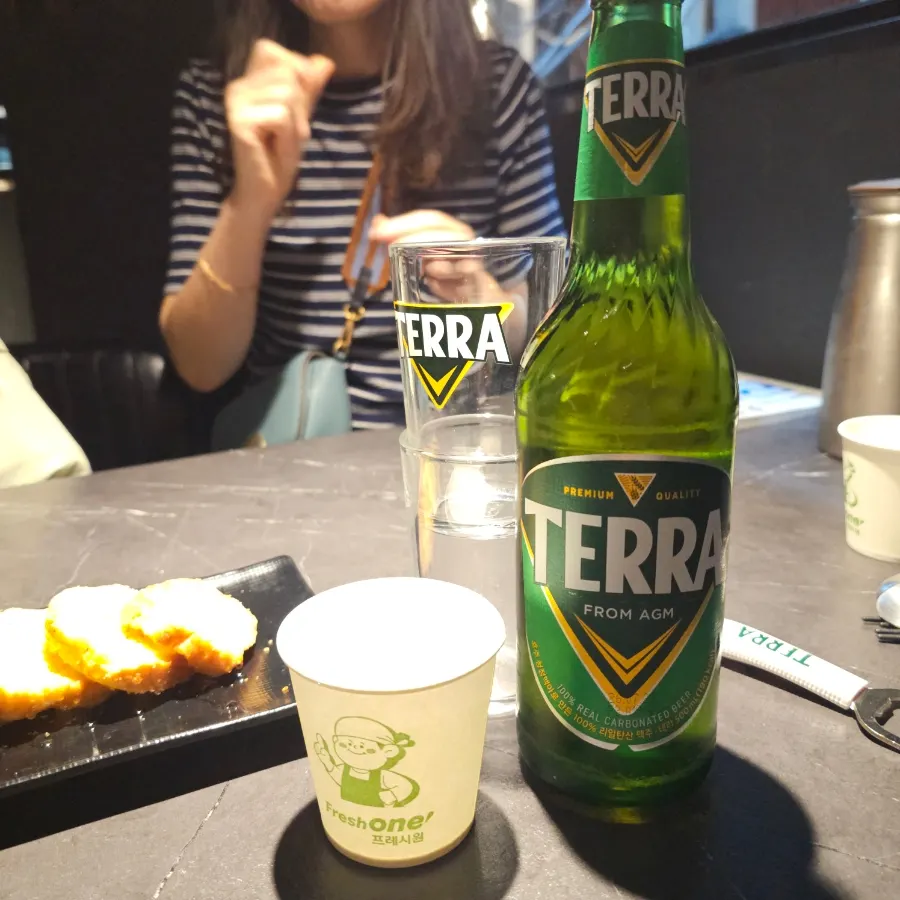 Garlic baguette with a cold glass of beer