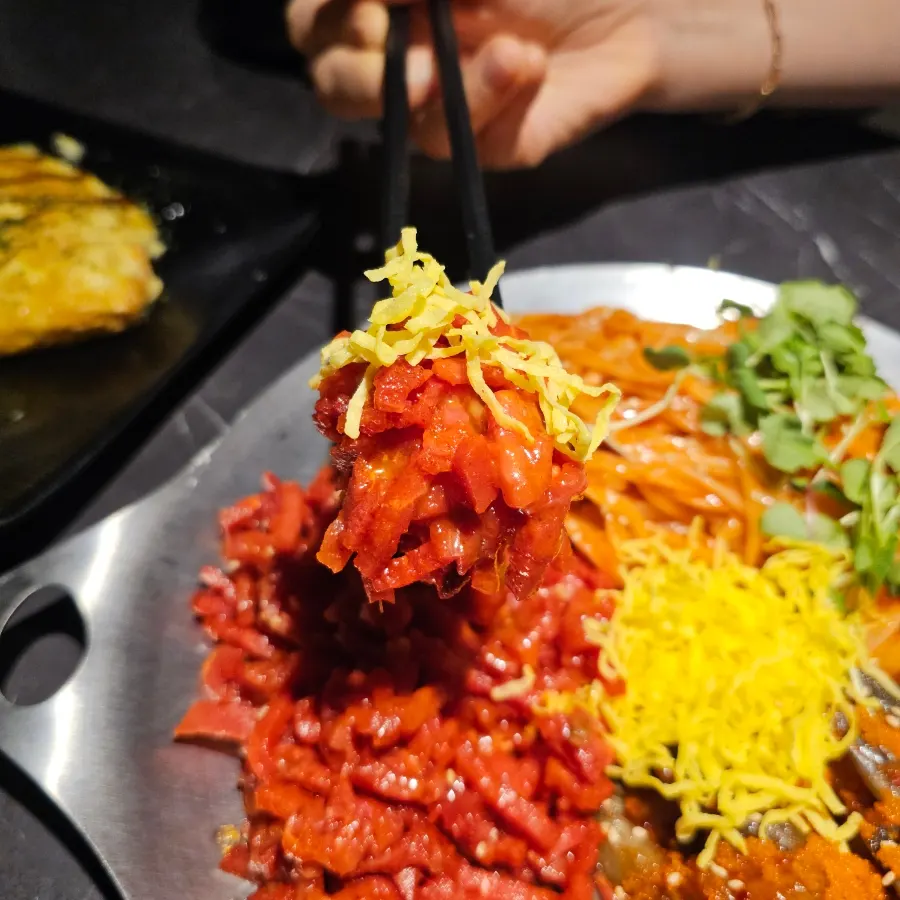 Yukhoe mixed with a burst egg yolk