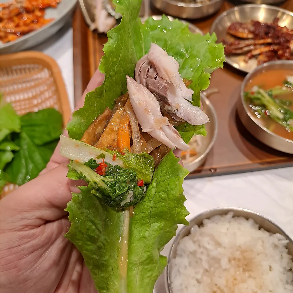 A spoonful of white rice with seasoned crab