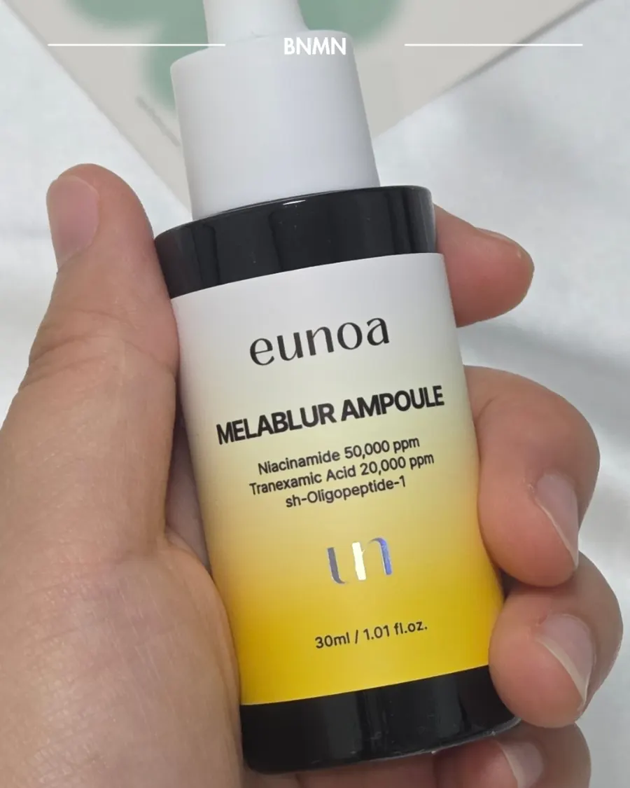 30ml dark spot ampoule bottle shown in hand for size comparison