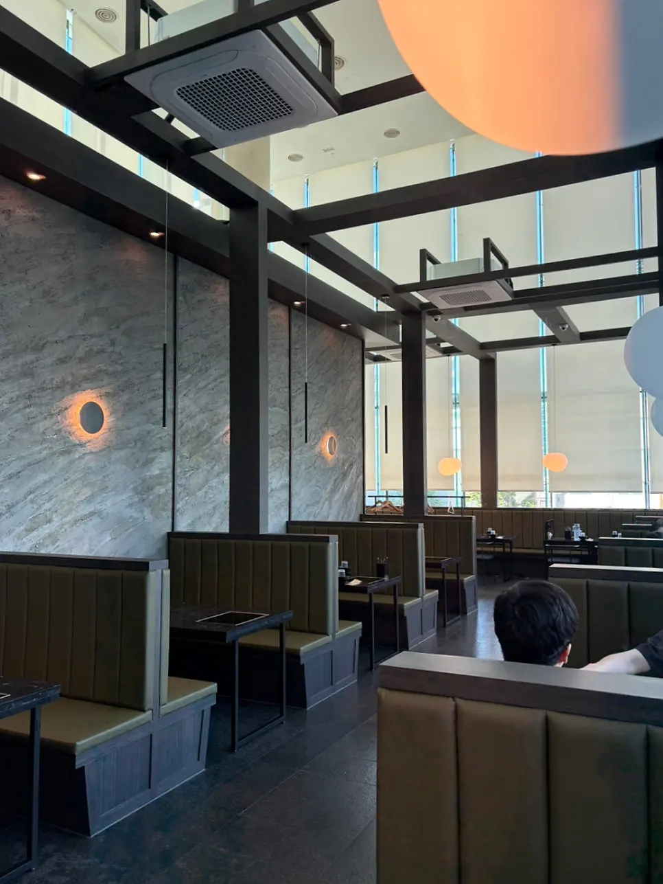 Table seating divided by partitions at Yunseul