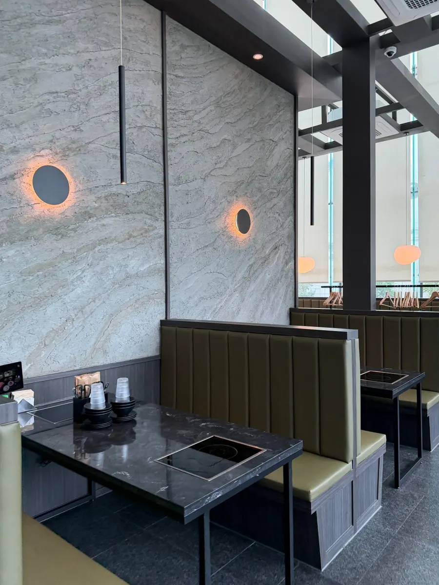 Seating by the floor-to-ceiling windows at Yunseul