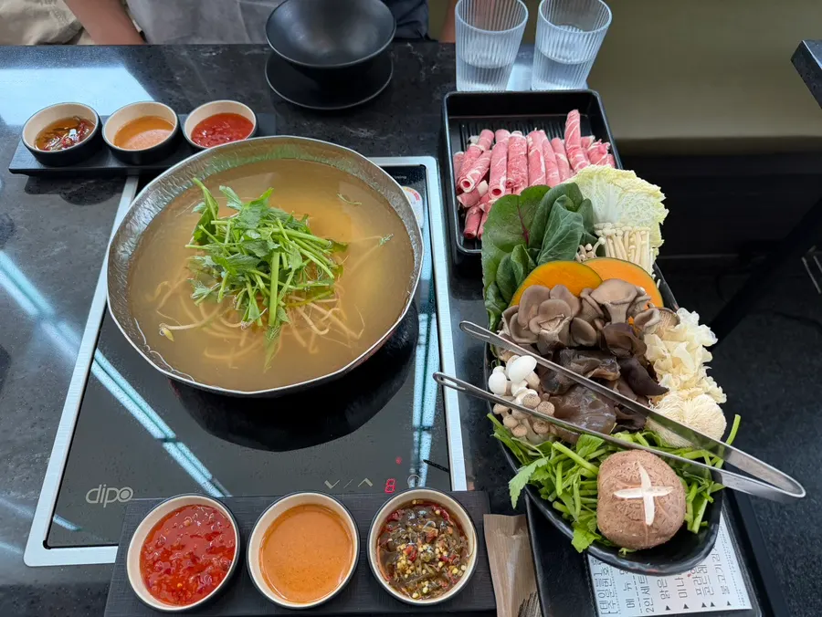 Clear anchovy broth shabu-shabu spread at Yunseul