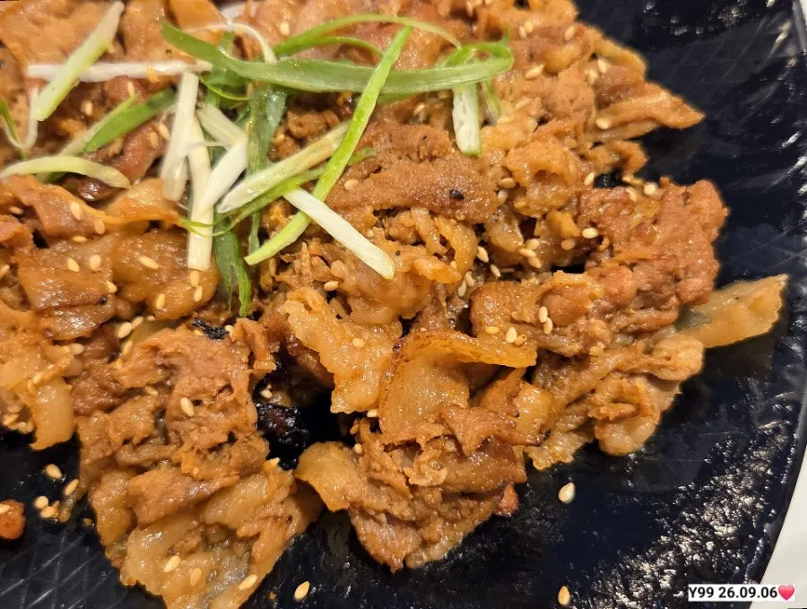 Table set with grilled bulgogi, grilled fish, kimchi pancake, and doenjang jjigae