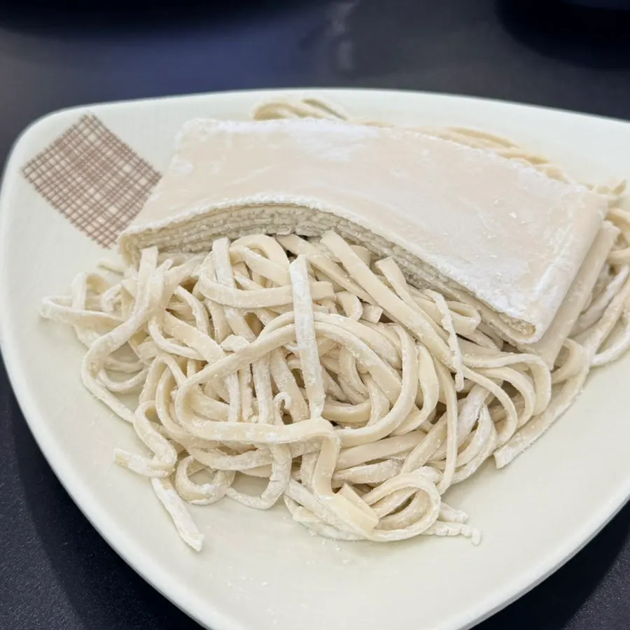 Kalguksu with half flat noodles and half regular noodles