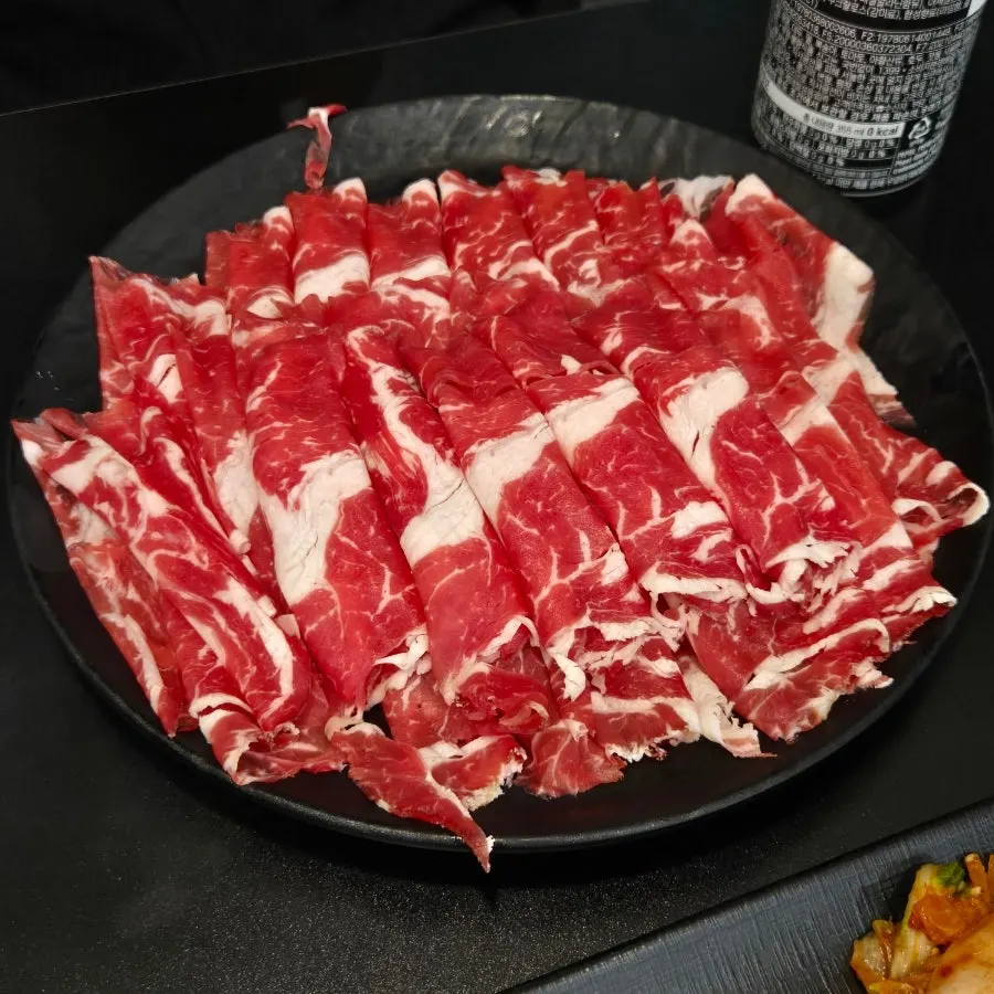 Spicy red shabu-shabu broth with minari