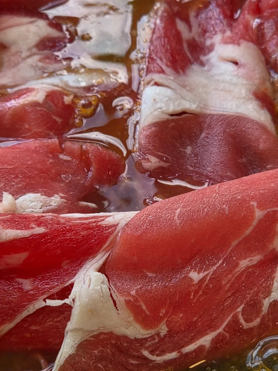 Sirloin cooked shabu-shabu style in spicy broth