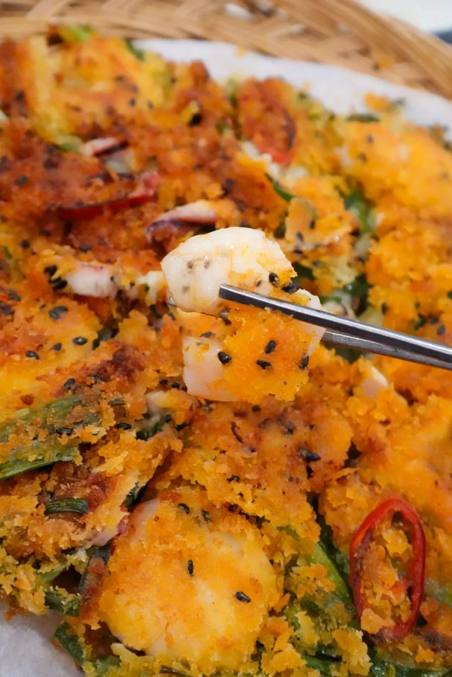 Cross-section of the seafood pancake packed with scallions