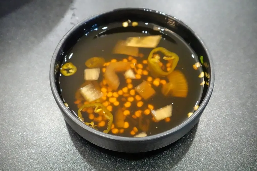 Seafood pancake sliced into pieces on a plate