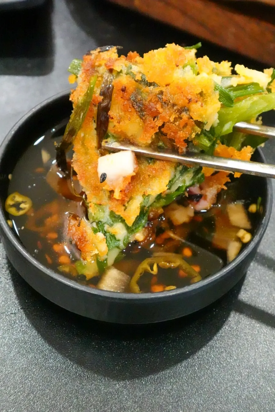 A piece of pancake with shrimp inside