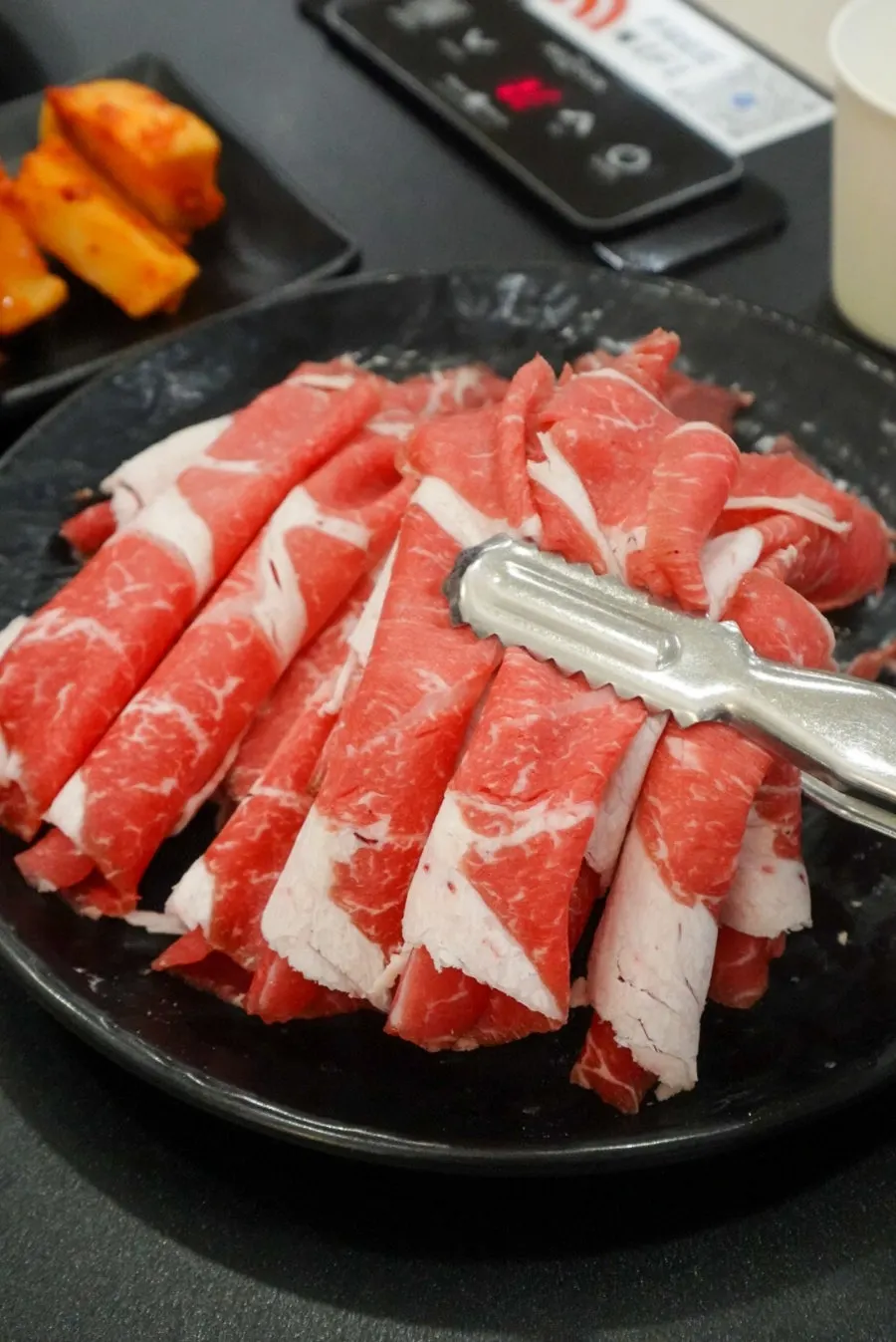 Basic table setting with sirloin, vegetables, and flat kalguksu