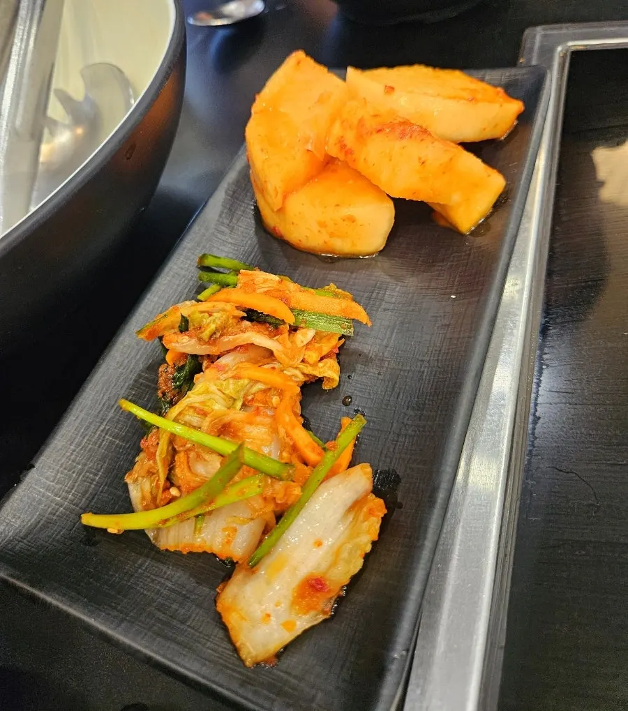 Basic shabu kalguksu table setting with side dishes