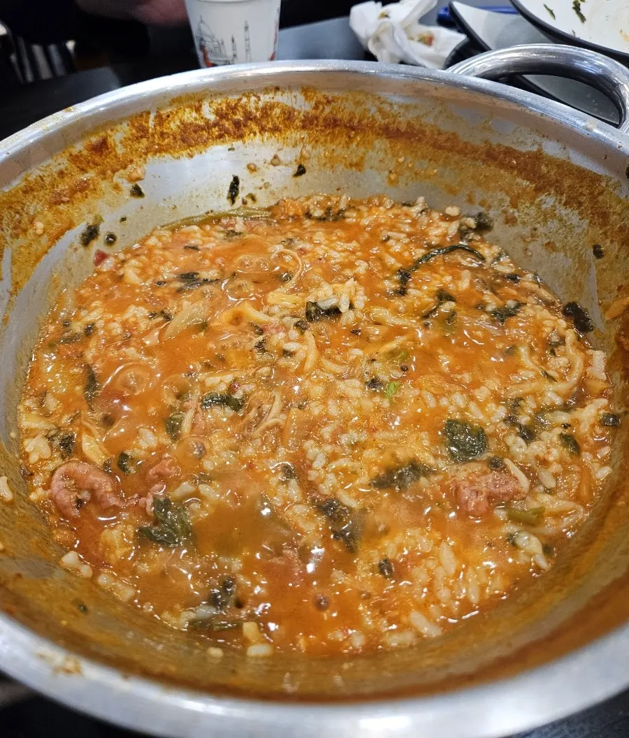 Self-fried rice topped with kimchi and seaweed flakes