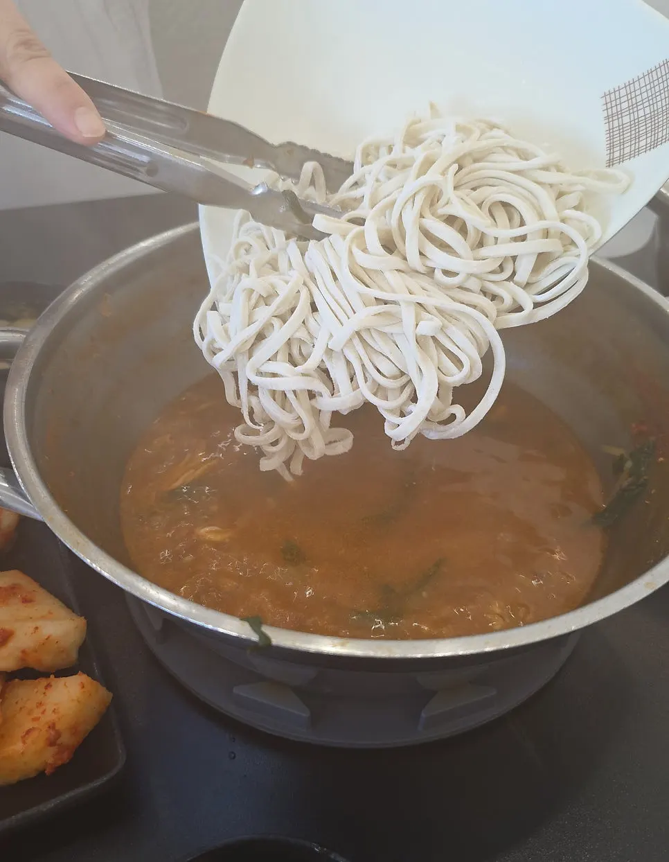 48-hour aged, foot-kneaded house-made kalguksu noodles