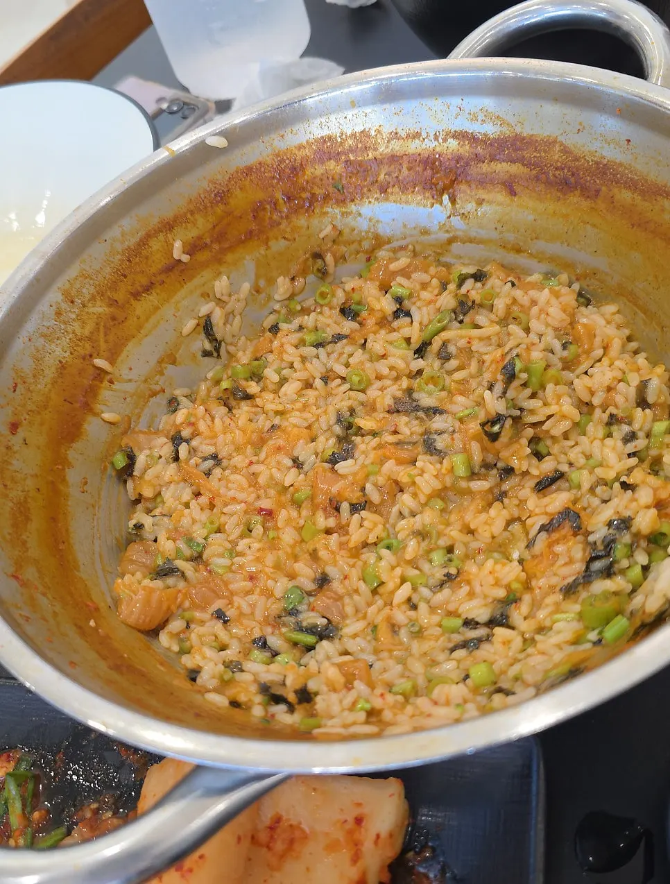 Frying rice in the leftover broth to finish the shabu-kalguksu meal