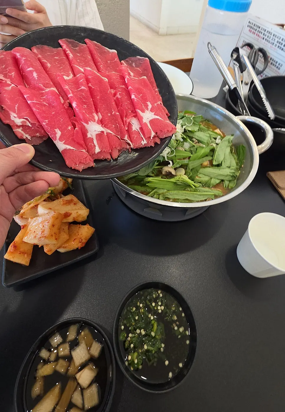 Picking up crunchy pieces of seafood pajeon one at a time