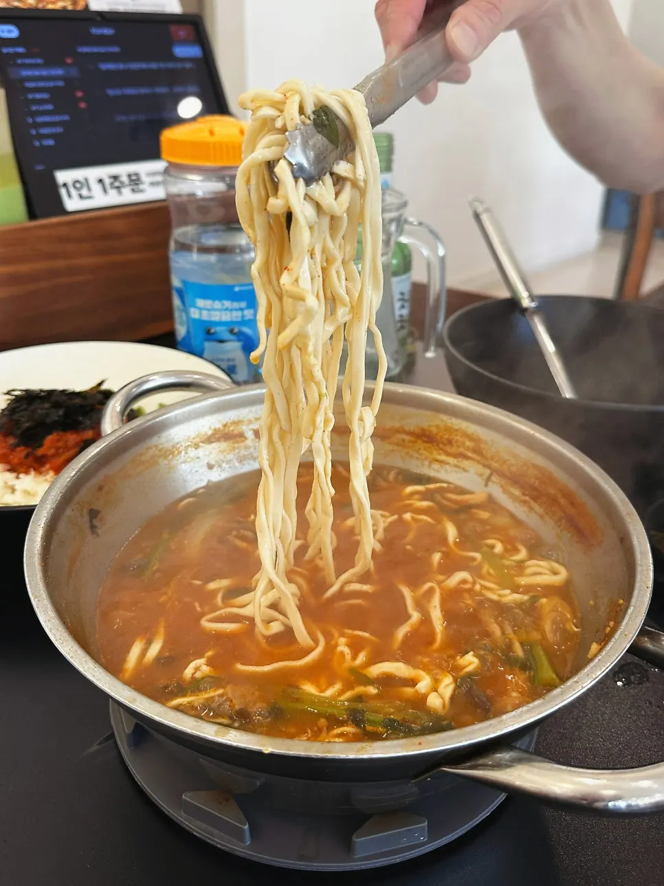 Self-made kalguksu noodles boiling in the broth