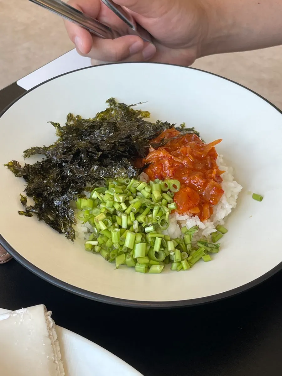 Kalguksu noodles dipped into the vegetable-infused broth