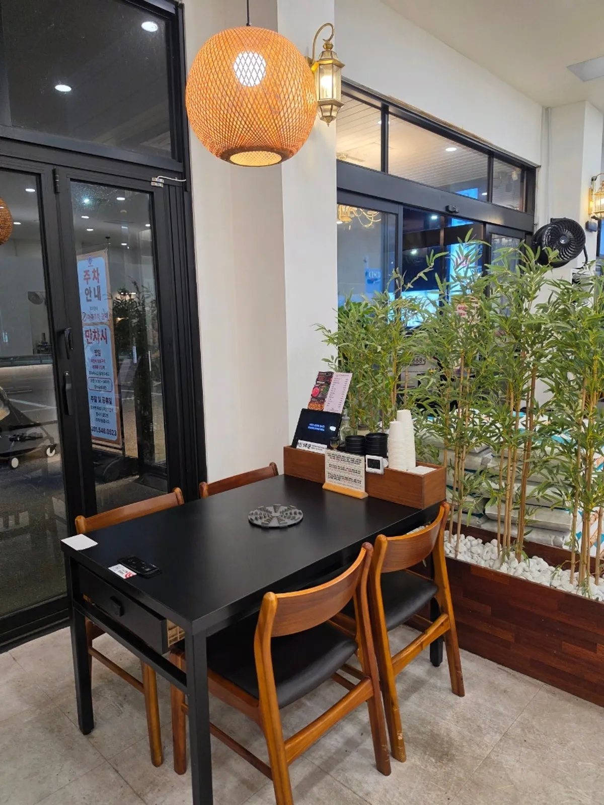 Table with fixed induction stovetop and kiosk