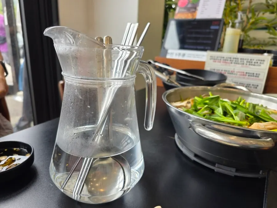Spoon set served soaking in hot water