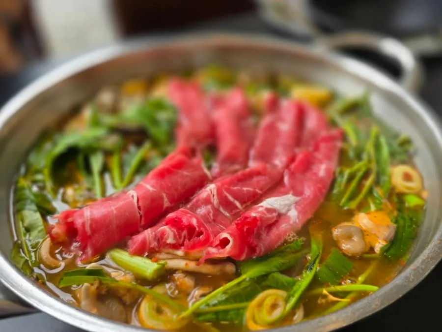 Shabu-shabu broth simmering with sirloin