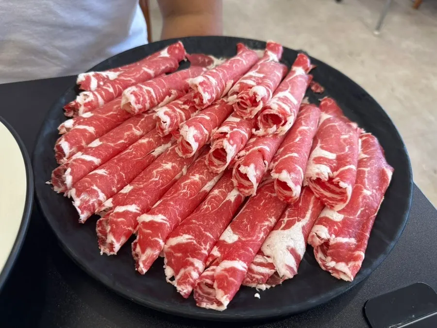 Adding a few pieces of meat while boiling the broth