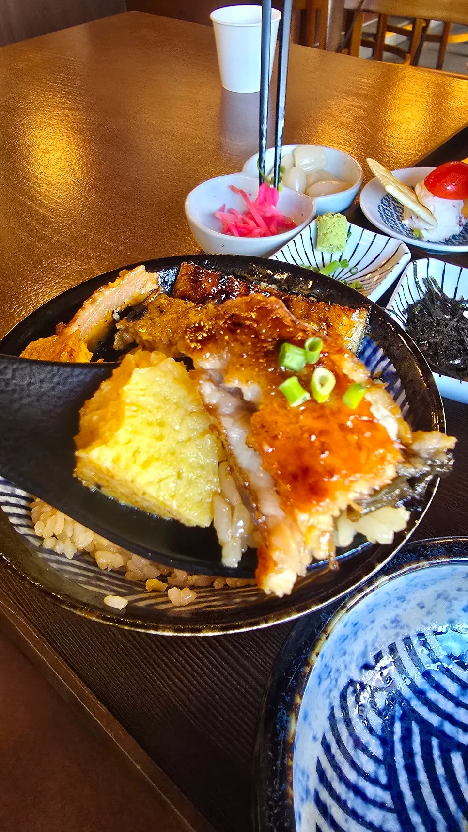 Picking up a piece of eel with chopsticks