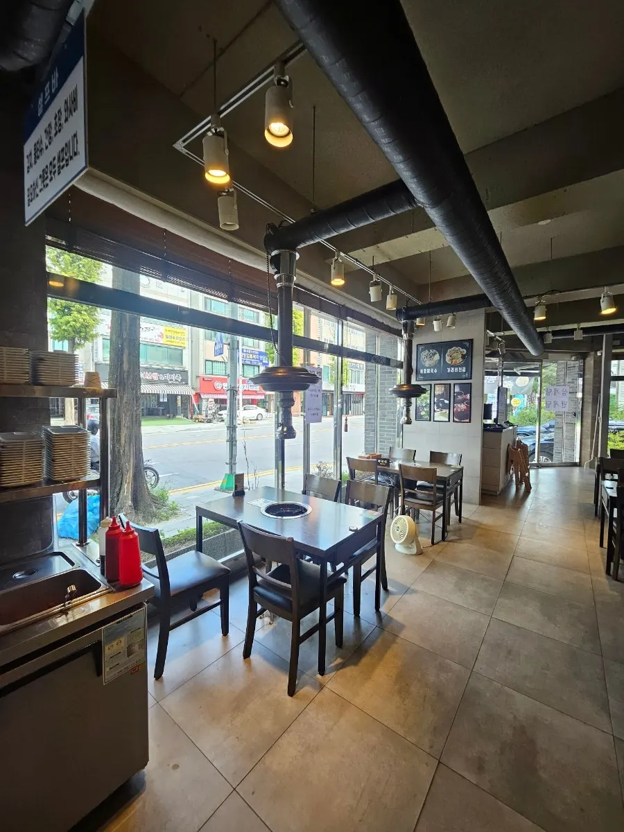 Restaurant interior with wood-toned tables