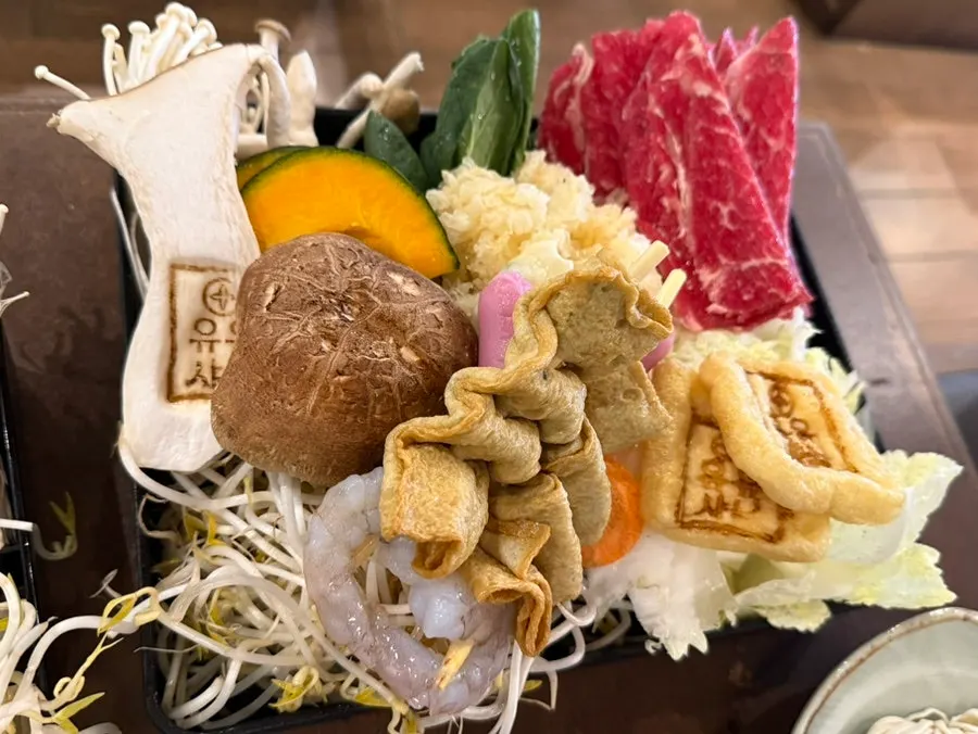 Plated spread of the half-and-half shabu