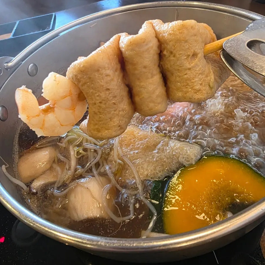 Table mid-meal during shabu-shabu