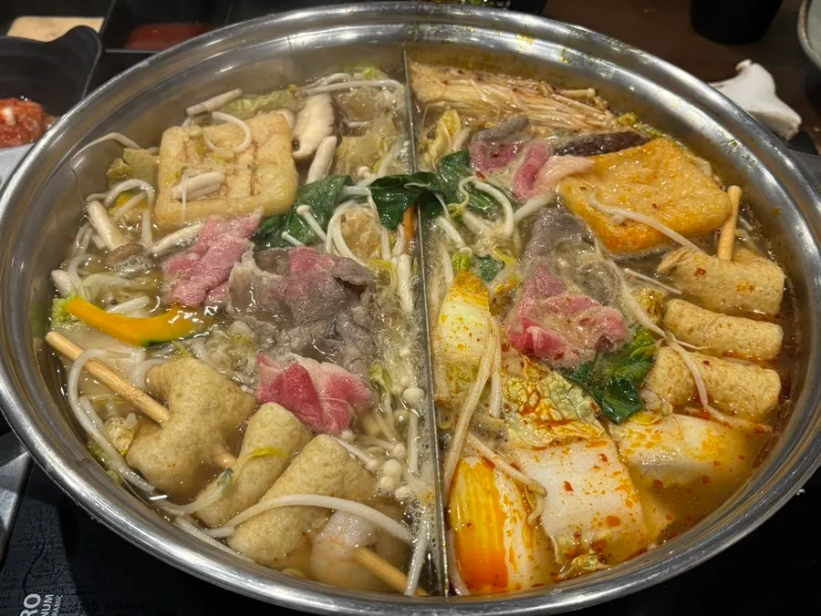 Shabu-shabu pot bubbling as everything cooks