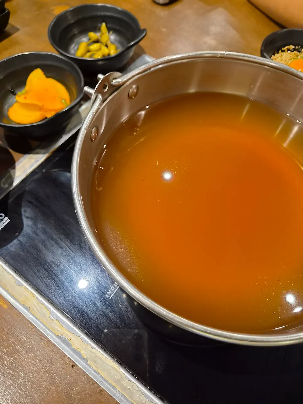 Yuyu Shabu main table setting with meat and vegetables