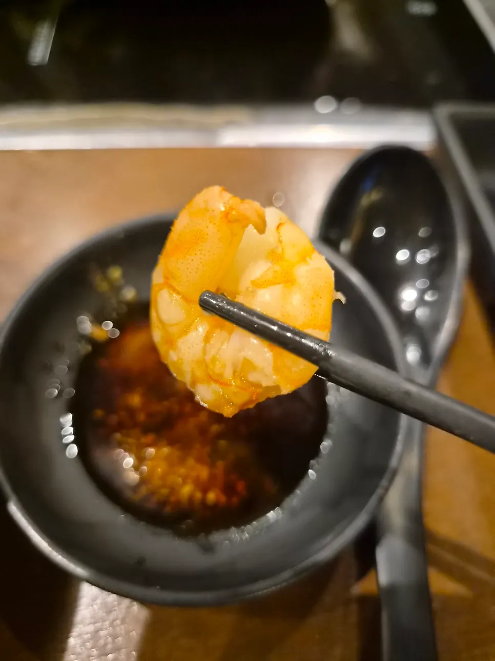 Dumplings and shrimp cooked in the shabu-shabu pot