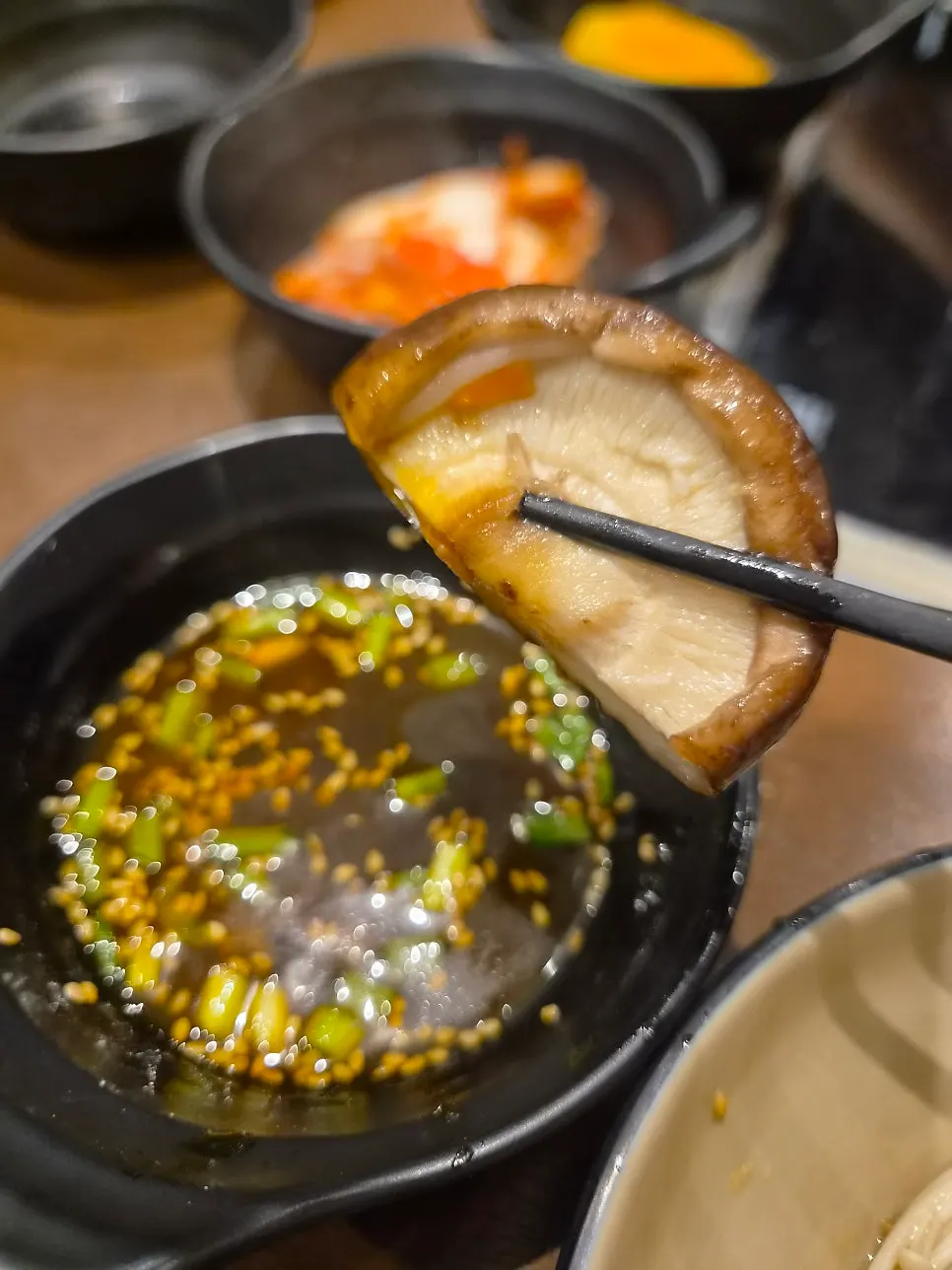 Pot with sweet pumpkin and enoki mushrooms added