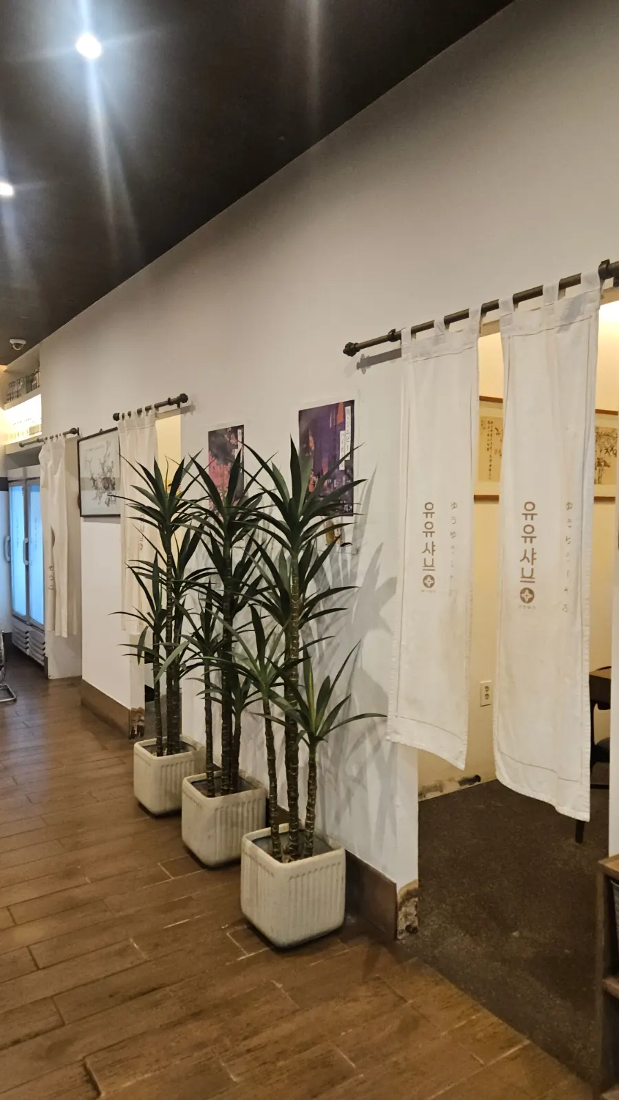 Hall seating with generous spacing between tables