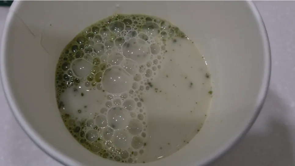 Matcha latte dissolving well in oat milk