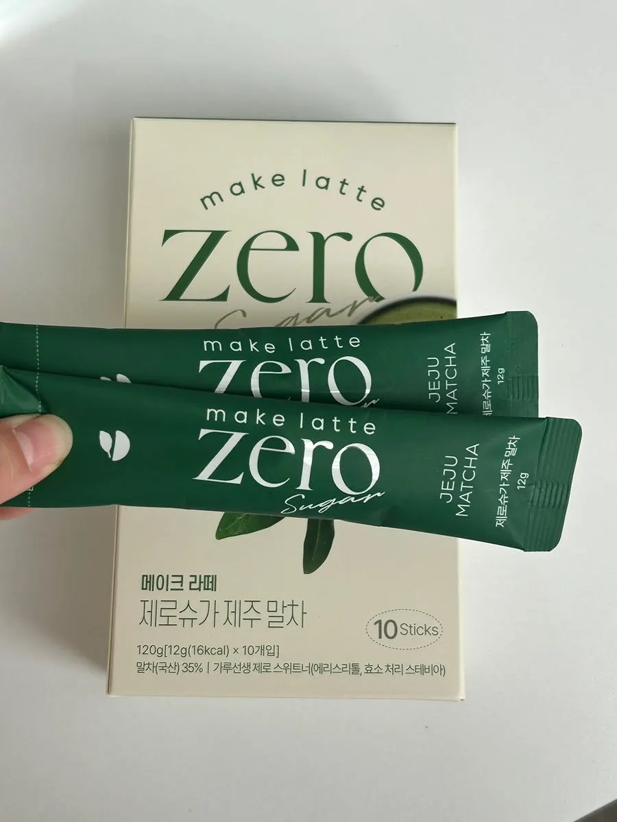 Pouring matcha powder into cold milk