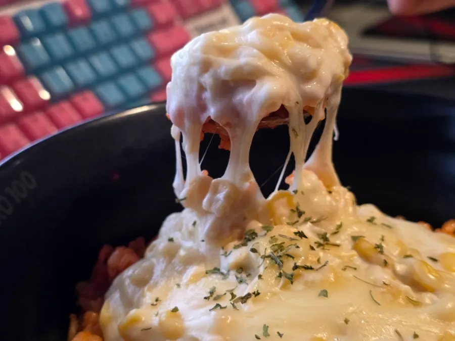 Corn mayo stretching from a spoonful